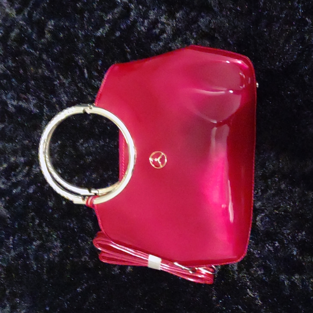 Authentic Mercedes Benz handbag burgundy in color